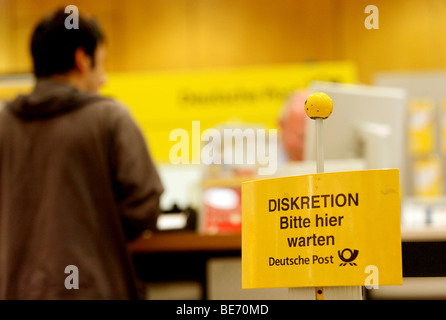 Discretion in front of the counter is a customer requirement at the post office in the main station of Stuttgart, Baden-Wuertte Stock Photo