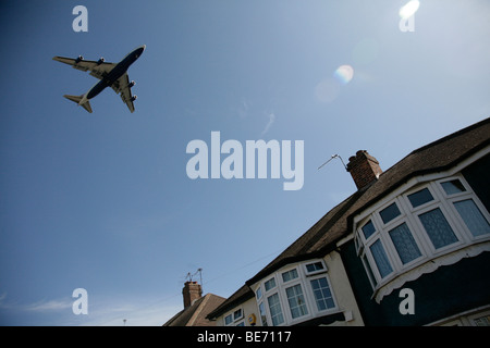 plane flying over house near heathrow airport Stock Photo