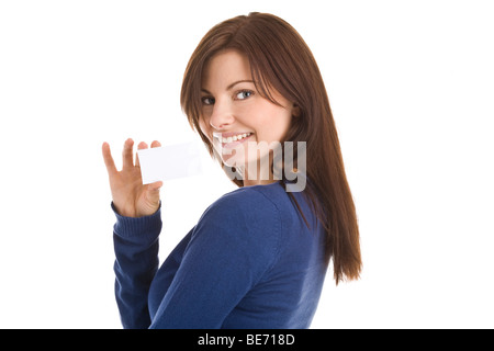 Portrait of young woman holding blank business card smiling isolated on white background Stock Photo