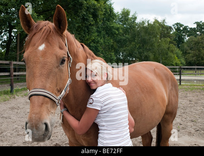 Teenage girl with a horse Stock Photo