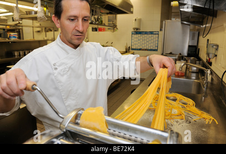 Cook making fresh pasta Stock Photo