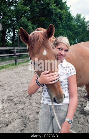 Teenage girl with a horse Stock Photo