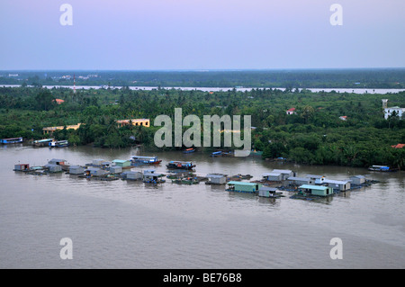 Floating fish farm in the Mekong river, Can Tho, Mekong Delta, Vietnam, Southeast Asia Stock Photo