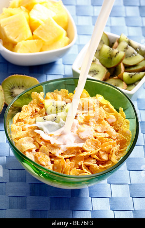 Cornflakes with kiwi and pineapple, milk Stock Photo