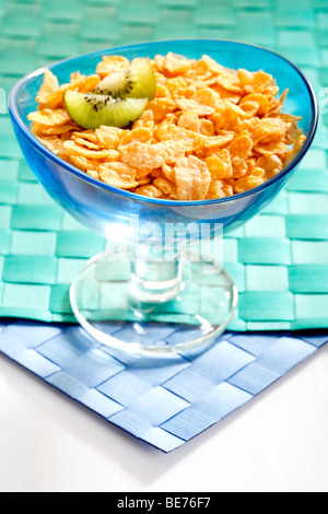 Cornflakes with kiwi slices in a bowl Stock Photo