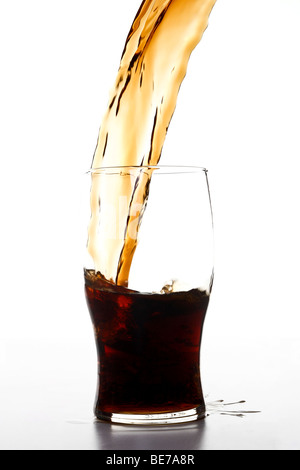 Cola being poured in a glass Stock Photo
