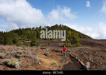 Woman hiking on the 'Ruta de los Volcanes, Volcano Route, La Palma, Canary Islands, Spain, Europe Stock Photo