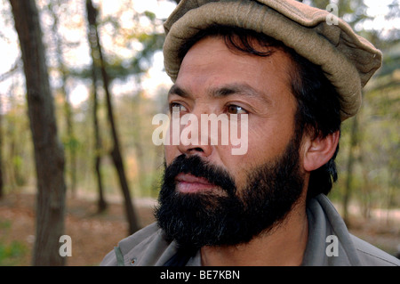 Portrait of a middle aged Pashtun Afghan man with a beard and wearing a wool pakol hat from the village of Istalif, north of Kabul, Afghanistan. Stock Photo