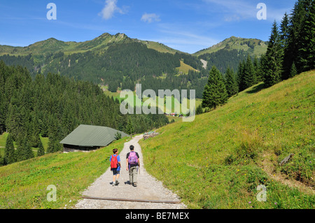 Hiking on the Panorama Trail in Baergunttal Valley, Kleinwalsertal, Little Walser Valley, Vorarlberg, Allgaeu Alps, Austria Stock Photo