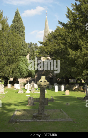 The churchyard of St Lawrence (partially visible through the trees) in the picturesque village of Lurgashall, West Sussex. Stock Photo