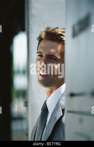 Businessman smiling and looking away, portrait Stock Photo