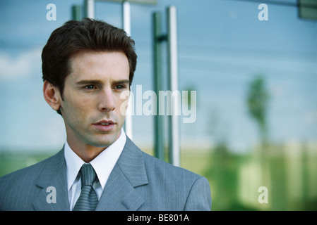 Businessman outside office building, portrait Stock Photo