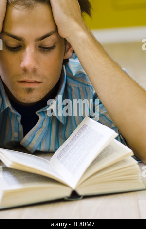 Young man reading book Stock Photo