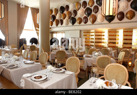 Tables are laid at  the deserted La Mer restaurant, Tides Hotel, Ocean Drive, South Beach, Miami Beach, Florida, USA Stock Photo