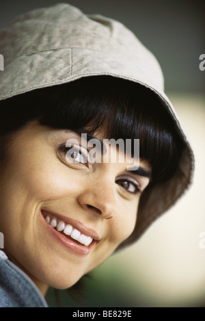 Woman wearing hat, smiling, portrait Stock Photo