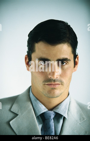 Businessman looking confidently at camera, portrait Stock Photo