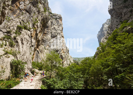 Hikers in a mountain scenery, Velika Paklenica, Paklenica National Park, Dalmatia, Croatia, Europe Stock Photo