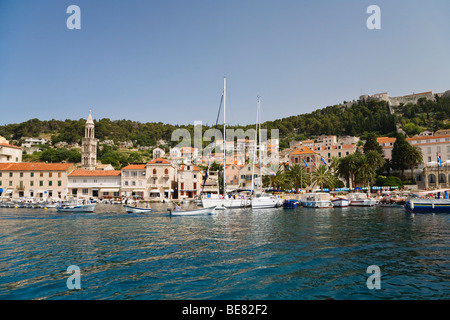 Boats and the harbour of Hvar under blue sky, Hvar Island, Dalmatia, Croatia, Europe Stock Photo