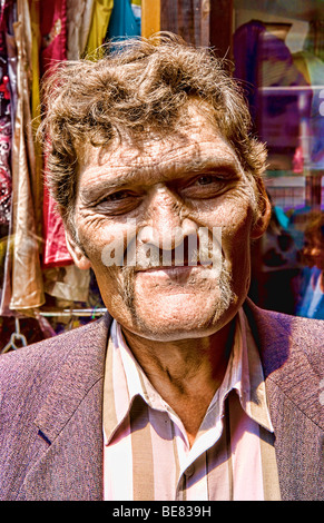 Tough looking giant man with extreme large head in city center in Lviv Ukraine Stock Photo