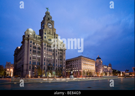 The Royal Liver, Cunard and Port of Liverpool Buildings at night (The Three Graces), Pier Head, Liverpool, Merseyside England Stock Photo