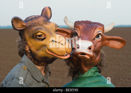 Two people wearing animal masks, close-up Stock Photo