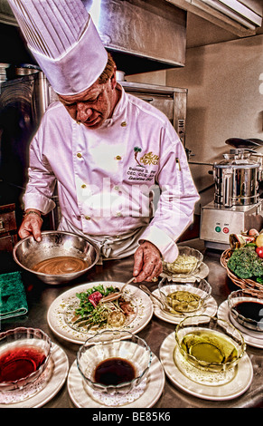 Chef preparing fine meal in fancy restaurant Stock Photo