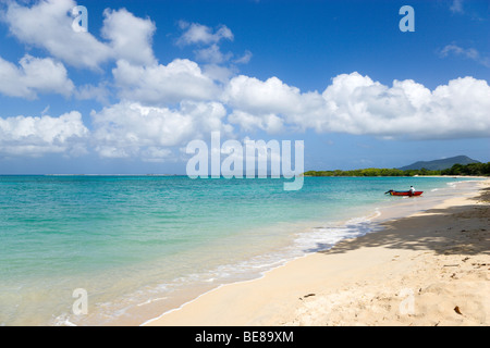 WEST INDIES Caribbean Grenadines Grenada Carriacou Island Paradise Beach at L'Esterre Bay Fisherman with his boat at shoreline Stock Photo