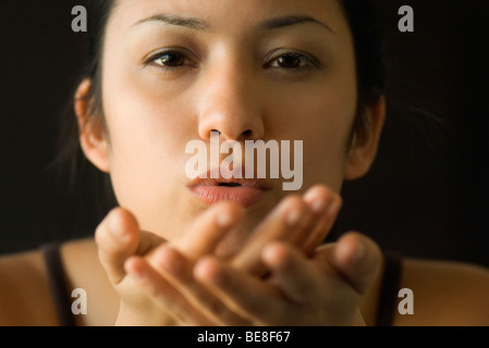 Woman blowing kiss, close-up Stock Photo