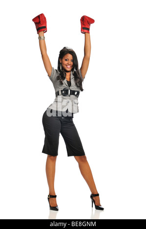 Woman expressing victory wearing boxing gloves isolated on a white background Stock Photo