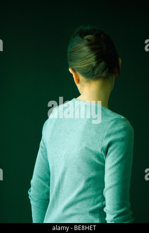 Young woman turning away from camera Stock Photo