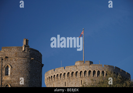 The Union Flag flying from the Round Tower of Windsor Castle, Berkshire, UK. (Henry III Tower to the left).
