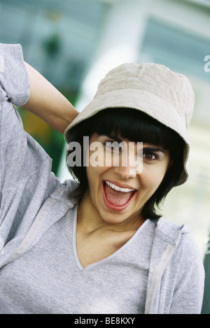 Woman smiling with looking of astonishment, portrait Stock Photo