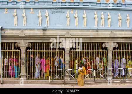 Hindu pilgrims waiting for hours in line to see the idol at Sri Venkateswara Temple in Tirupati India Stock Photo