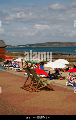 two striped deck chairs on the seafront promenade at shanklin isle of wight Stock Photo