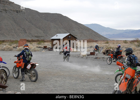 dirt bike riders having fun in the ghost town of ballarat in death valley california Stock Photo