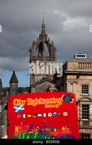 Tourist taking photograph from sighteeing Tour bus, Edinburgh Scotland Stock Photo