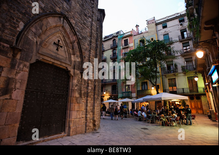 People dining alfresco on Placa Sant Jesep Oriol in Barri Gotic. Barcelona. Spain Stock Photo