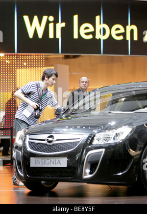 Visitor at the new Opel Insignia at the 63. IAA Motor Show in Frankfurt/Germany Stock Photo