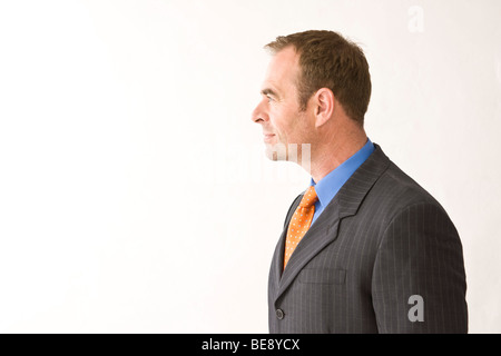 Man wearing a suit, in profile Stock Photo