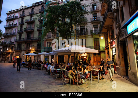 People dining alfresco on Placa Sant Jesep Oriol in Barri Gotic. Barcelona. Spain Stock Photo