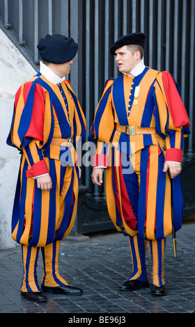 ITALY Lazio Rome Vatican City Two Swiss Guards in full ceremonial uniform dress in conversation. Stock Photo