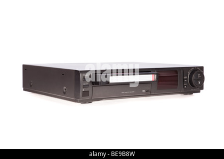 Old Video Cassette Recorder ejecting tape isolated on white background Stock Photo