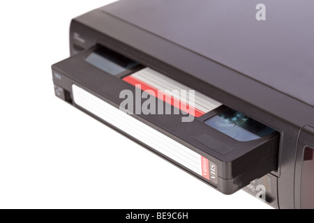 Old Video Cassette Recorder ejecting tape isolated on white background Stock Photo