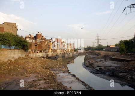 A canal used as an open sewer between Janpura and Nizamuddin, New Delhi, India Stock Photo
