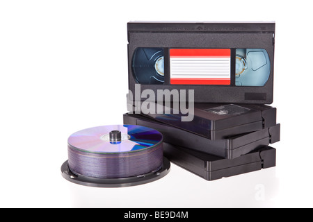 Old Video Cassette tapes with DVD discs isolated on white background Stock Photo