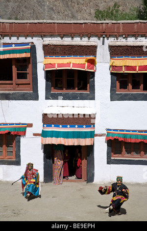 Buddhist monks dressed with traditional costumes and masks performing a ritual dance. Phyang Gompa festival. Ladakh. India Stock Photo