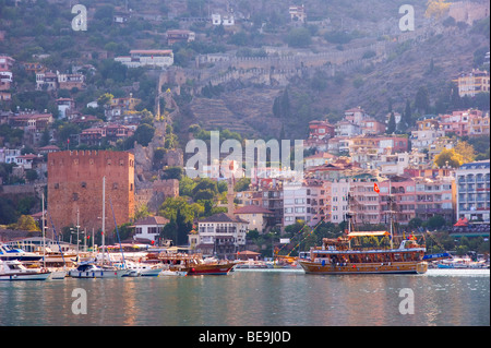 Alanya harbour in Mediterranean Turkey showing the Red Tower and sailing boats Stock Photo