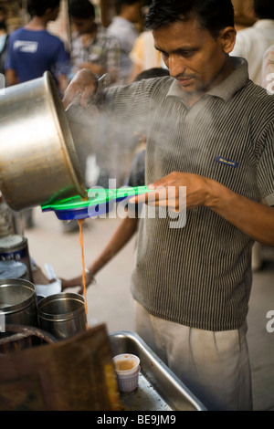 A Chai Wallah or tea maker makes tea in Old Delhi, India Stock Photo