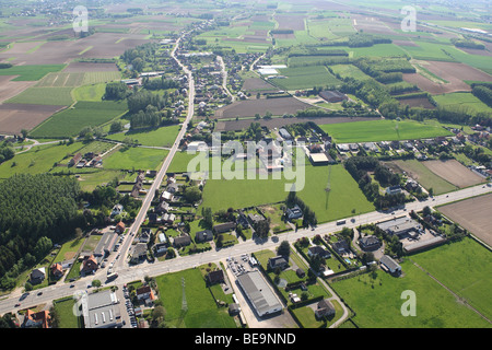 Urbanisation at the border of agricultural area with fields, grasslands and hedges from the air, Belgium Stock Photo