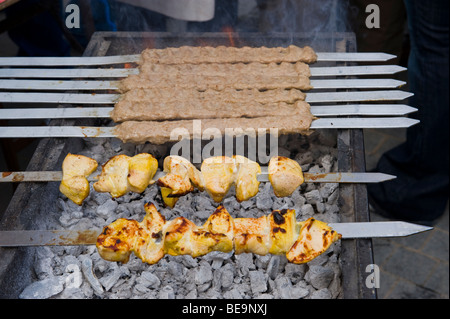 Kebabs being cooked on barbecue at Abergavenny Food Festival Monmouthshire South Wales UK Stock Photo